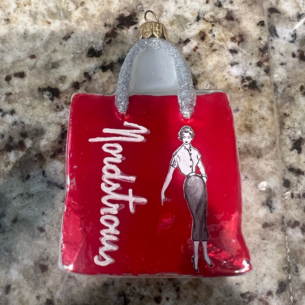 Nordstrom Christmas ornament red shopping bag dated 2014.  Blown glass.